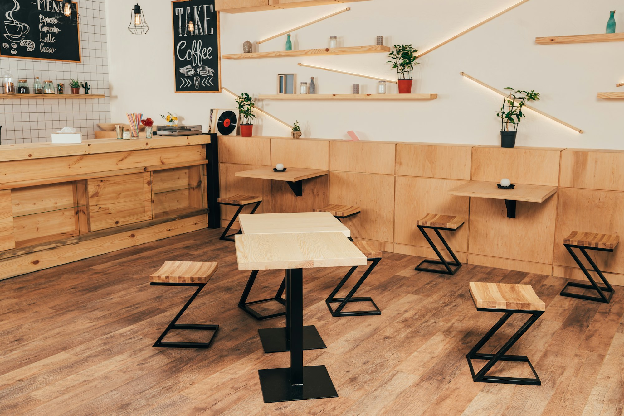 stylish interior of modern cafe with stylish wooden furniture