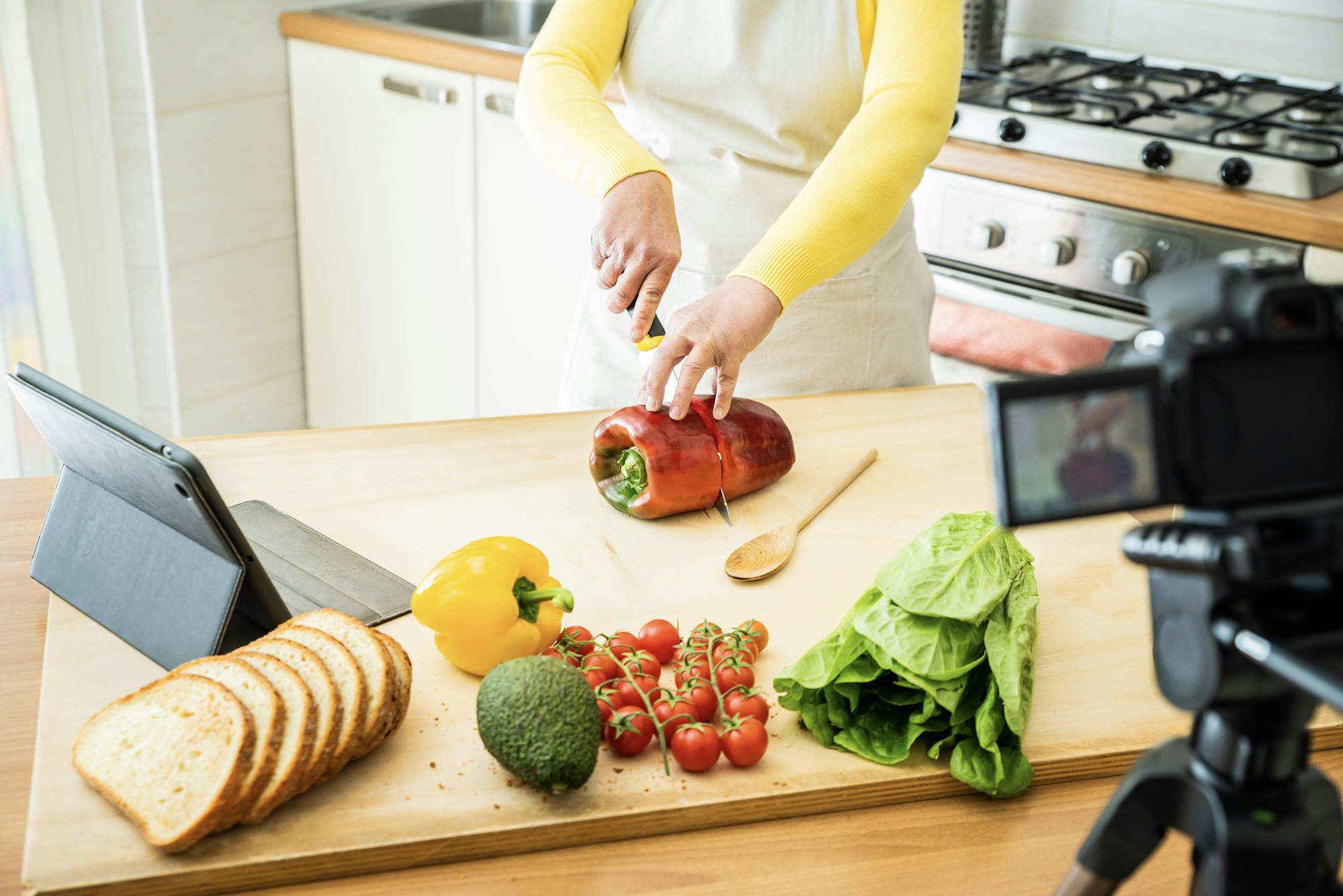 Food blogger recording video tutorial at home